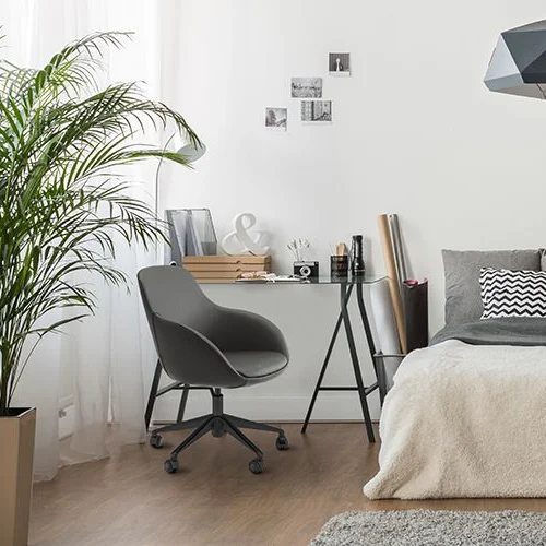 Elevate your décor with an armchair designed with rounded lines that flow seamlessly into its sturdy and stylish legs.