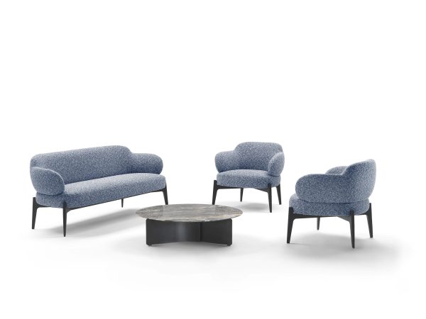 Infuse your décor with sophistication through our designer armchair, elegantly perched on its legs.
