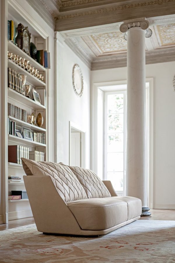 Sink into comfort with the plush cushions and impeccable detailing of this luxury modern sofa