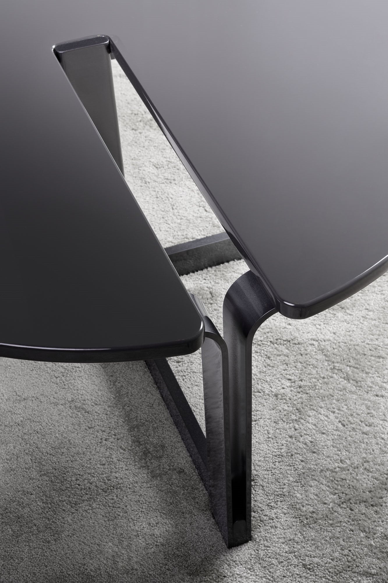 The Cut-Out Coffee Table is a stunning and innovative piece that combines modern design with functional elements.