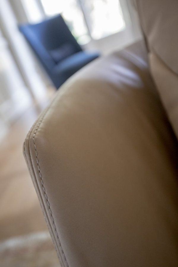 The perfect blend of style and comfort, this modern sofa boasts stitched cushions for a touch of elegance