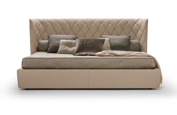 a grand, luxurious bed with diamond-shaped stitching on the curved headboard, perfect for creating an opulent and sophisticated atmosphere