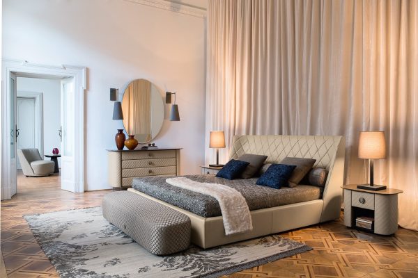 a true masterpiece of design, this large bed features a beautiful diamond-shaped headboard and a sleek, modern base that will elevate any bedroom