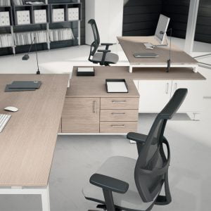 A large L-shaped desk with plenty of storage and work space
