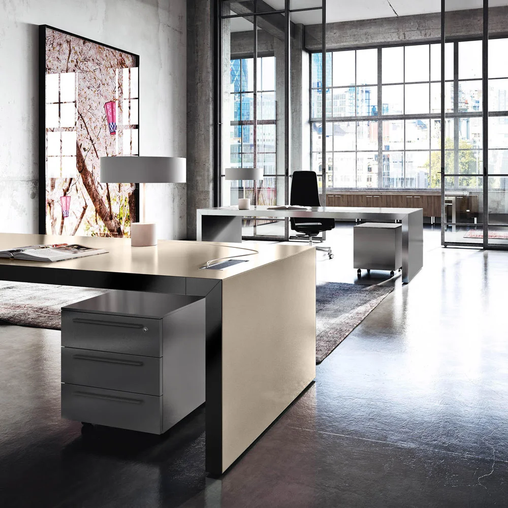 Embrace the embodiment of executive luxury with our striking L-shaped desk, distinguished by its magnificent wood construction and ergonomic design elements