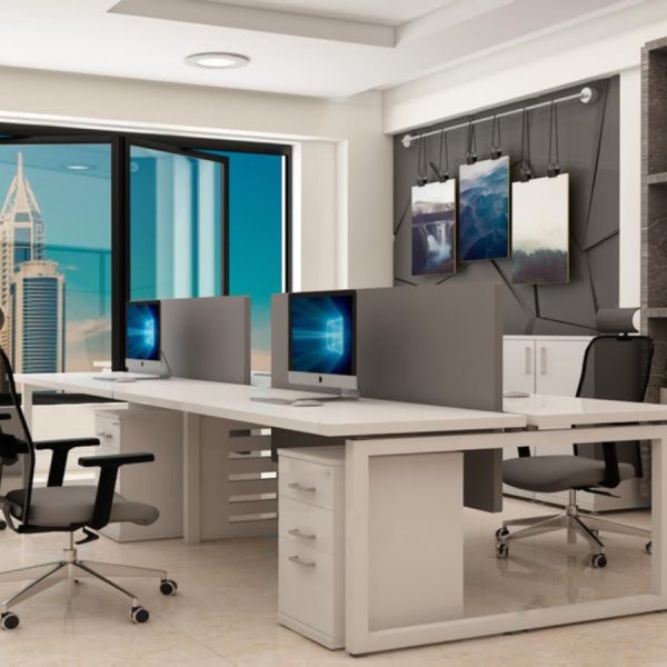 Multi-user office desk setup for enhanced teamwork.