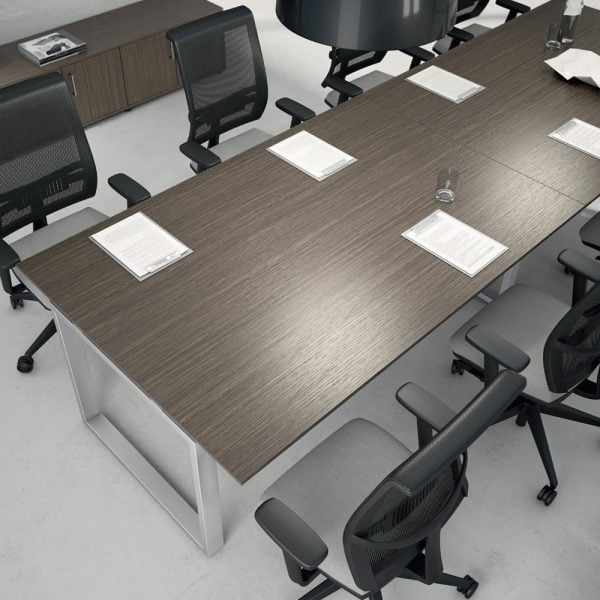 The meeting room features a contemporary table with a wooden top that can accommodate up to 10 people