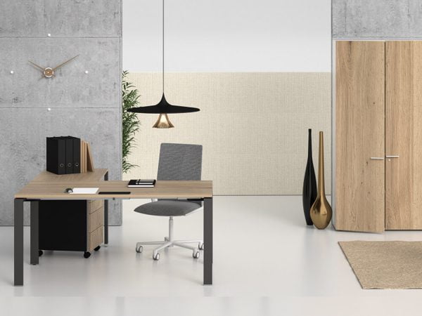 A height-adjustable standing desk converter, offering managers the flexibility to switch between sitting and standing positions.