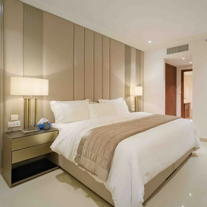 King-size bed with nice bedside tables and a full height headboard