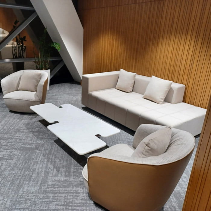 Living room set with a sofa, armchairs and a white marble coffee table