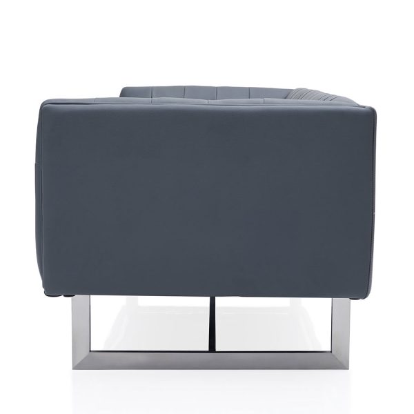Indulge in luxury and sophistication with our modern capitone sofa featuring a chic low back and contemporary metal leg support.